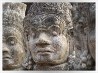 head of a granite statue at Angkor Wat temple in Cambodia